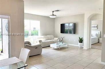 living room featuring light tile patterned flooring