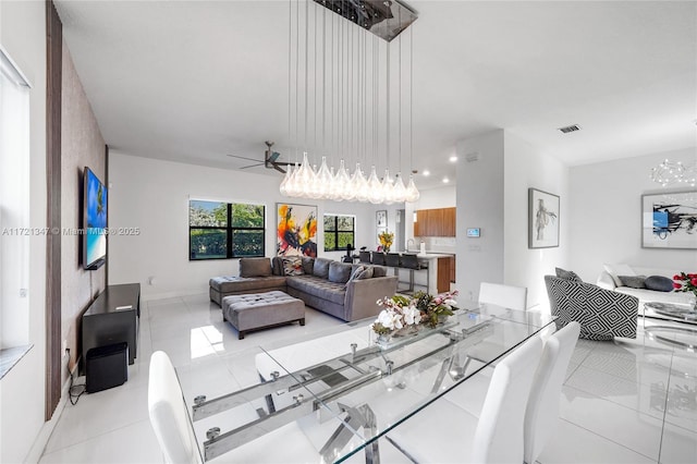 tiled living room with ceiling fan