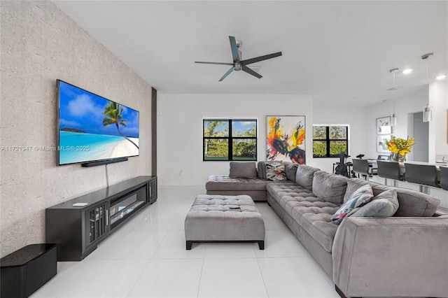 living room featuring light tile patterned flooring and ceiling fan