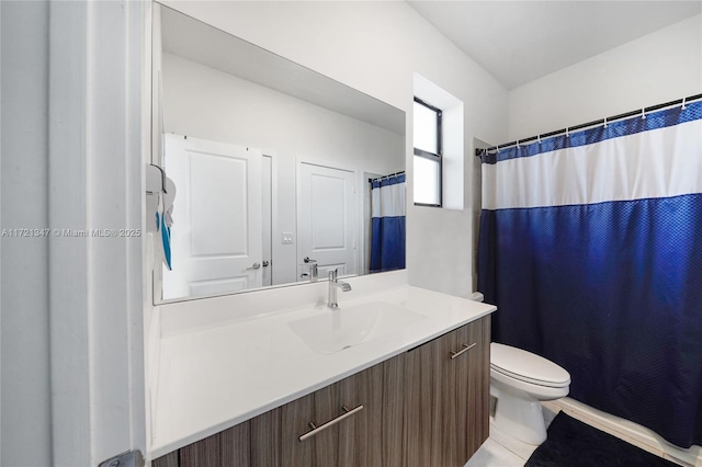 bathroom featuring toilet, vanity, tile patterned floors, and curtained shower