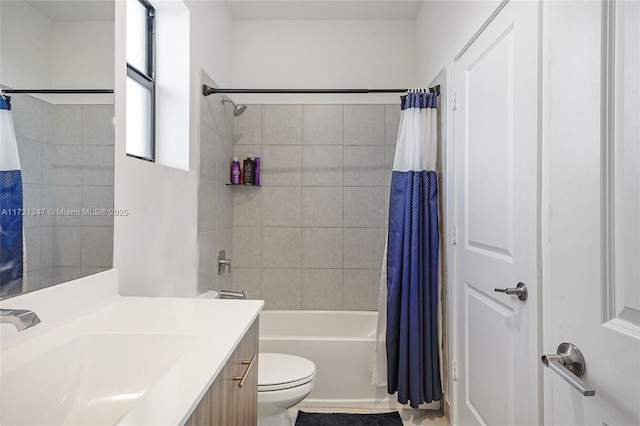 full bathroom featuring toilet, vanity, tile patterned floors, and shower / bath combination with curtain