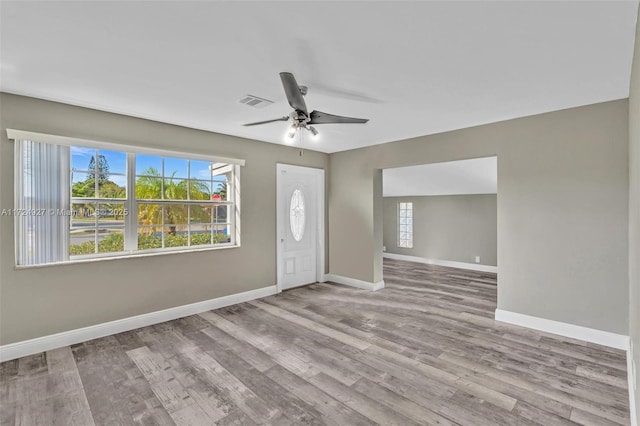 entryway with ceiling fan and light hardwood / wood-style flooring