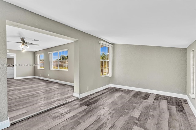 empty room featuring ceiling fan and wood-type flooring