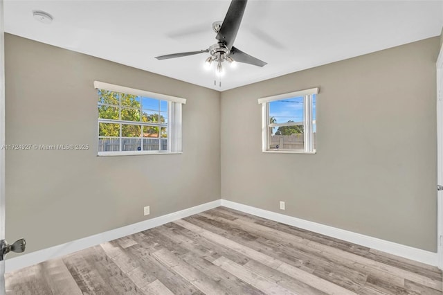 unfurnished room featuring ceiling fan and light wood-type flooring