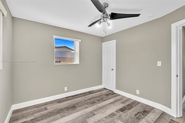 spare room with ceiling fan and light hardwood / wood-style floors