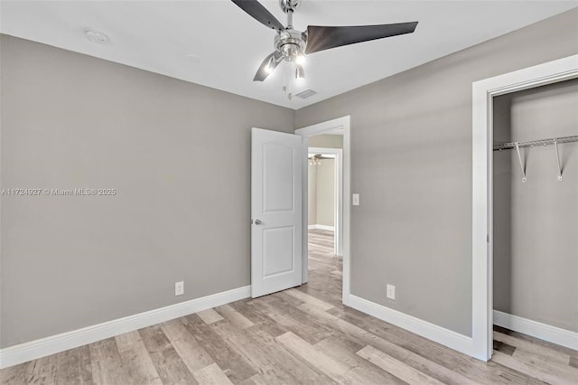 unfurnished bedroom with a closet, ceiling fan, and light hardwood / wood-style flooring