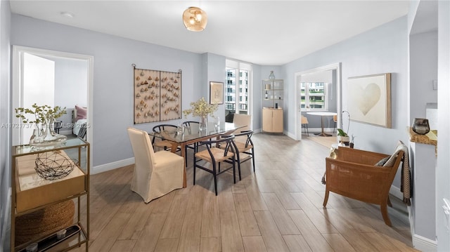 dining room with light hardwood / wood-style flooring