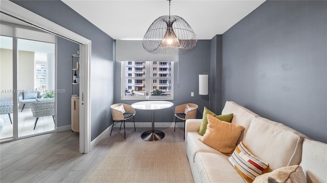 sitting room with hardwood / wood-style flooring