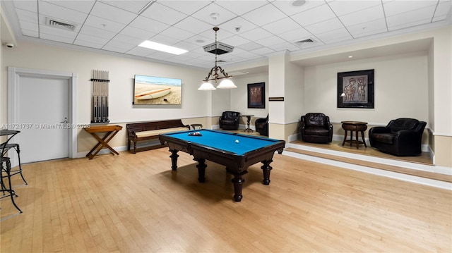 rec room featuring hardwood / wood-style flooring, billiards, and a paneled ceiling