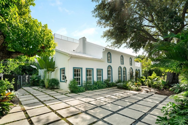 back of property featuring a patio