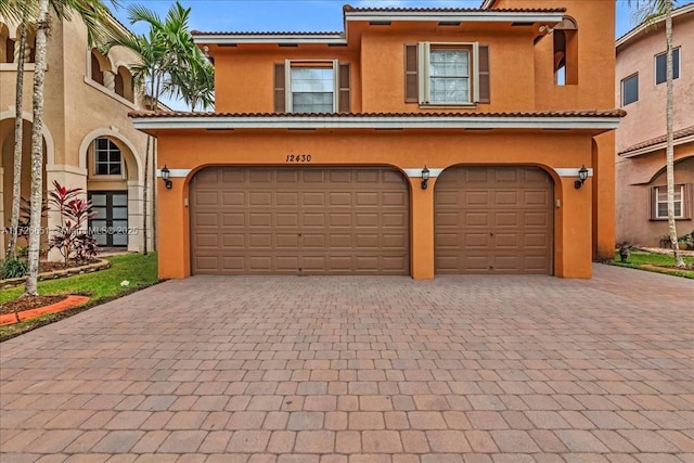 mediterranean / spanish-style house featuring a garage