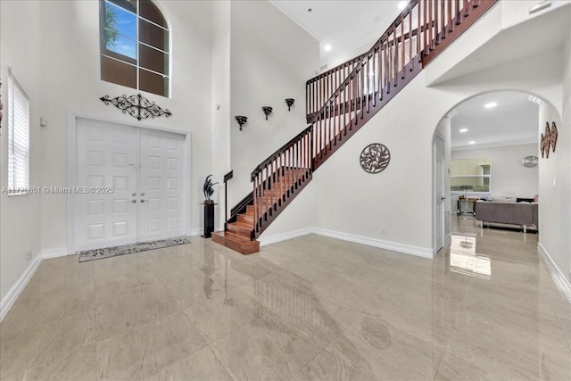 entrance foyer featuring crown molding