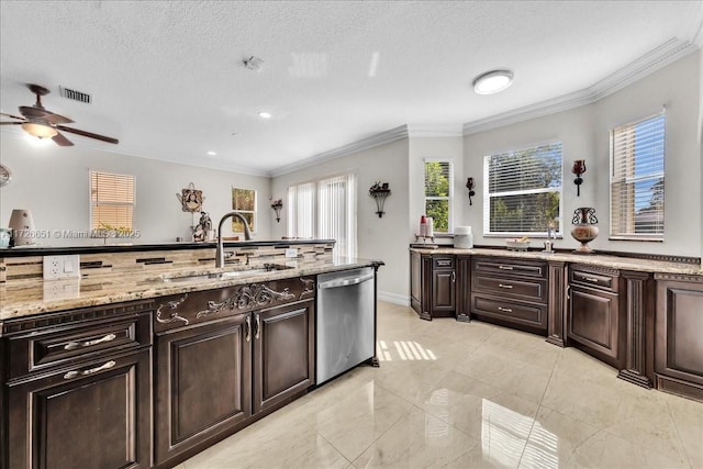 kitchen featuring sink, stainless steel dishwasher, crown molding, and dark brown cabinetry