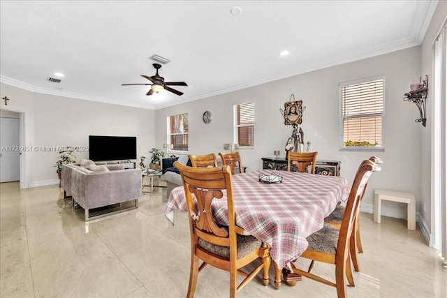 dining room with ceiling fan and ornamental molding