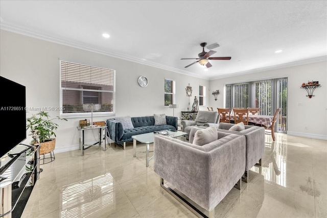 living room featuring ceiling fan and crown molding