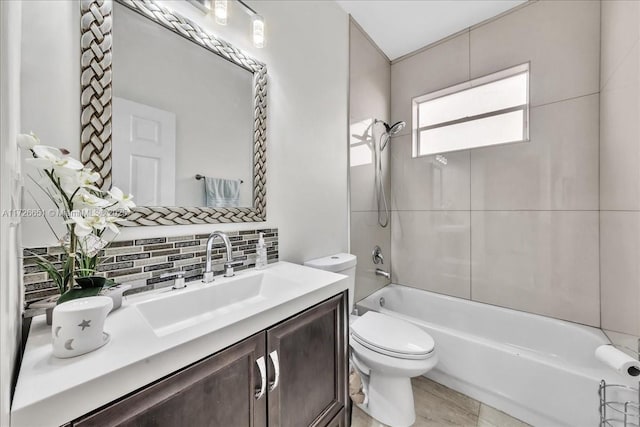 full bathroom with toilet, vanity, tasteful backsplash, and shower / bath combination