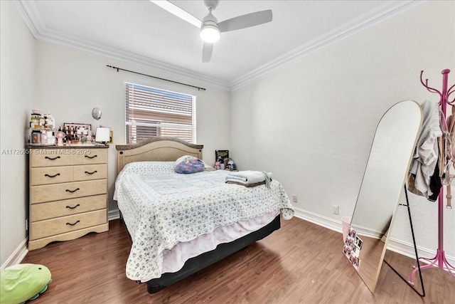 bedroom with ornamental molding, ceiling fan, and dark hardwood / wood-style floors