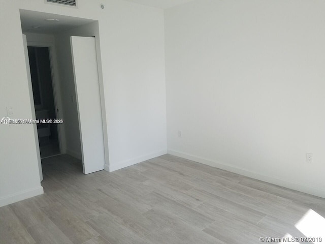 empty room with light wood-type flooring