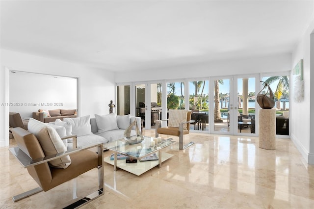 living room featuring french doors and a wealth of natural light