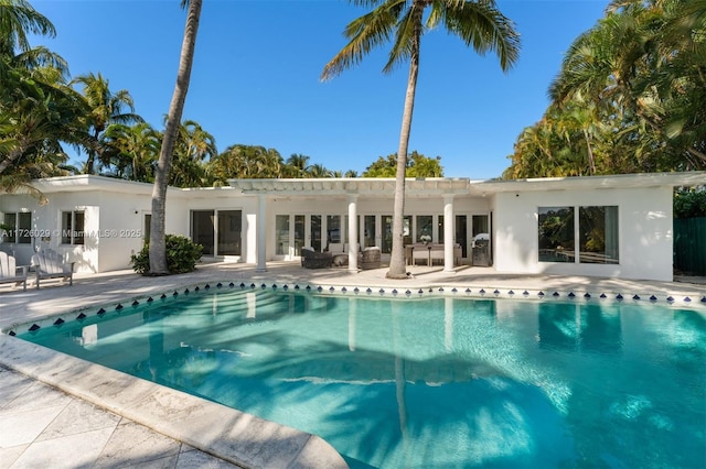 view of swimming pool featuring a patio area