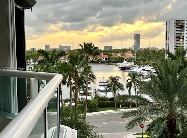 balcony at dusk with a water view