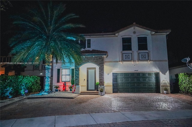 mediterranean / spanish-style house featuring a garage