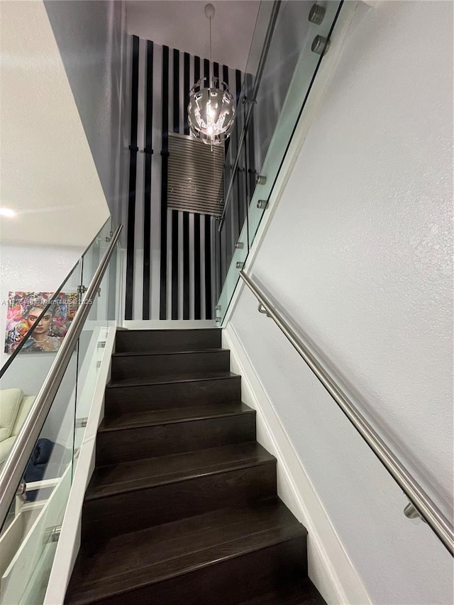 staircase featuring hardwood / wood-style flooring