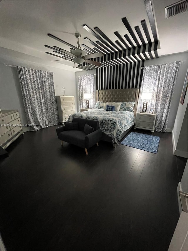 bedroom featuring dark hardwood / wood-style floors and ceiling fan