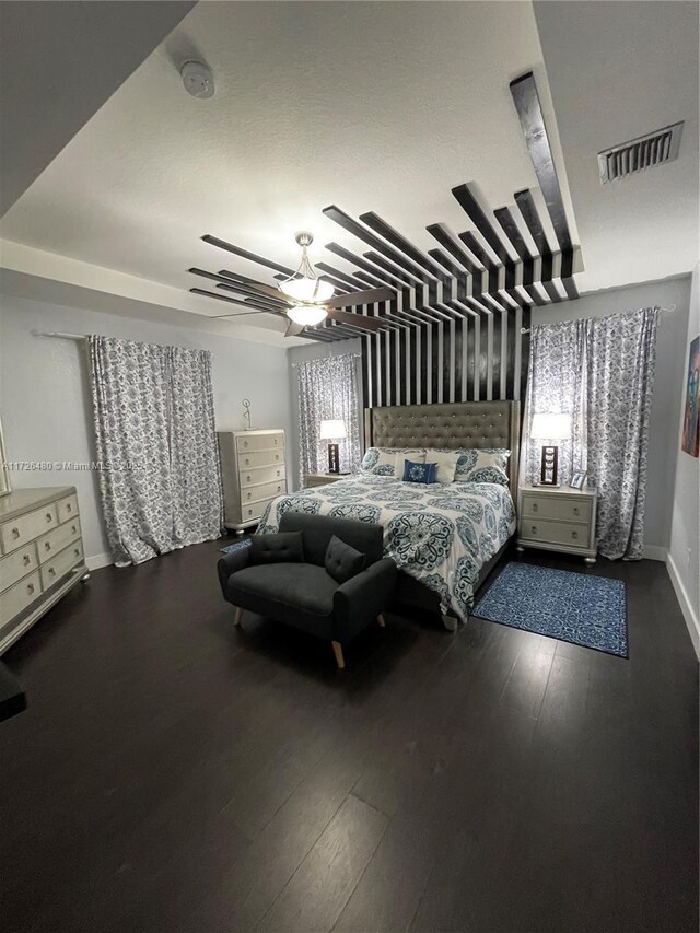 bedroom with hardwood / wood-style flooring and ceiling fan