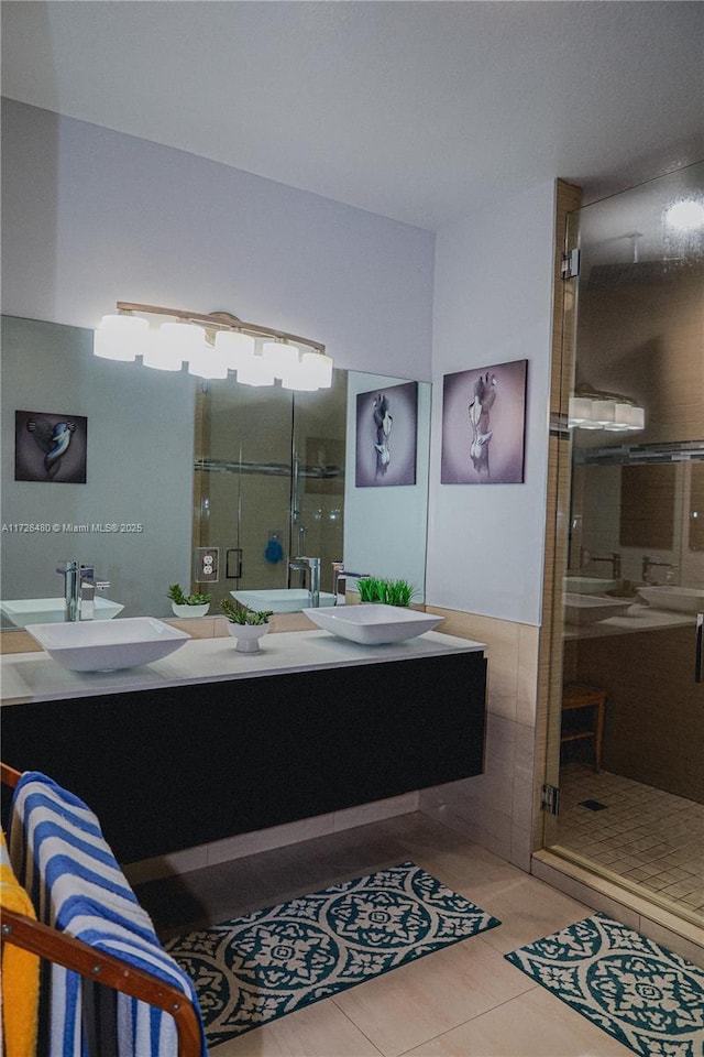 bathroom featuring walk in shower, tile patterned floors, and vanity