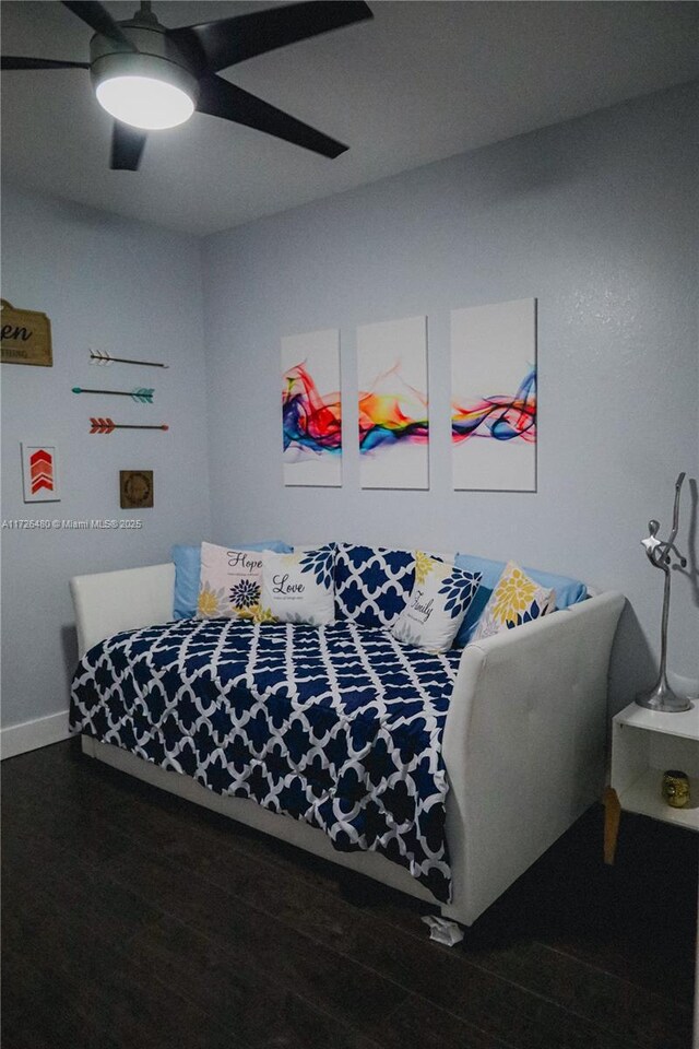 bedroom featuring wood-type flooring and ceiling fan