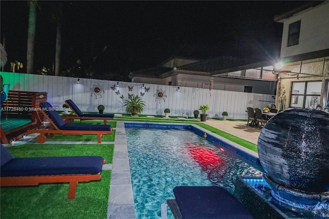 view of swimming pool featuring a patio area