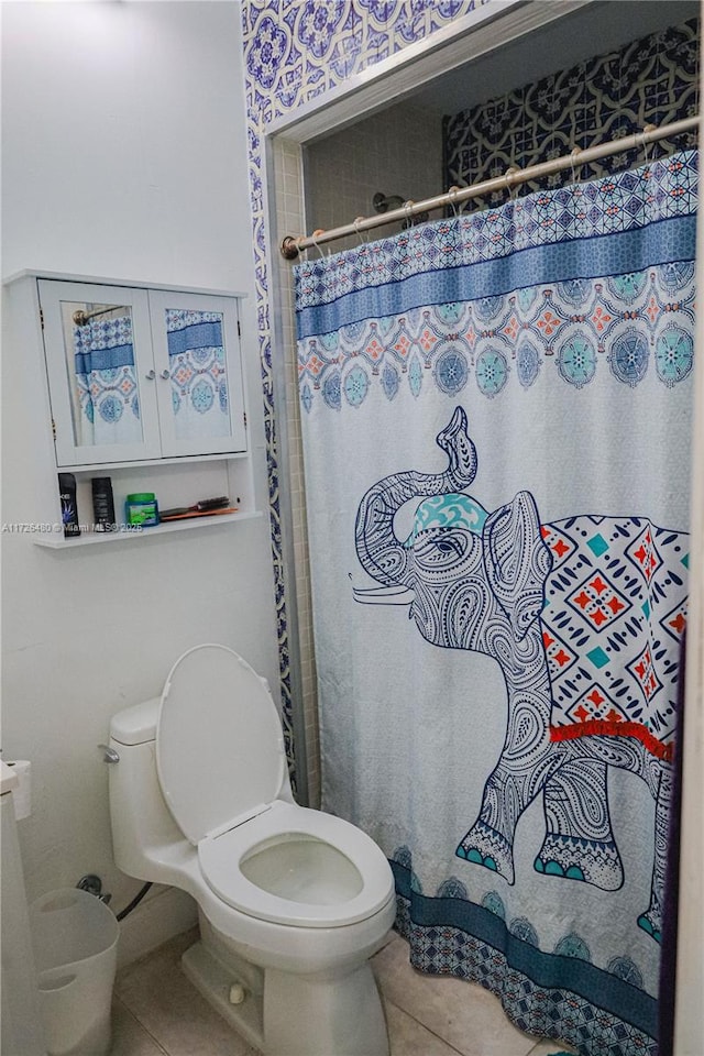 bathroom with tile patterned floors and toilet