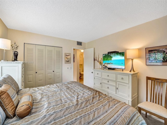 bedroom with a closet and a textured ceiling