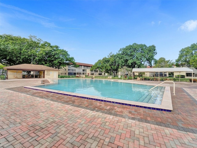 view of swimming pool with a patio