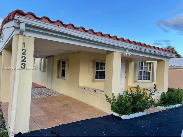 view of home's exterior with a carport