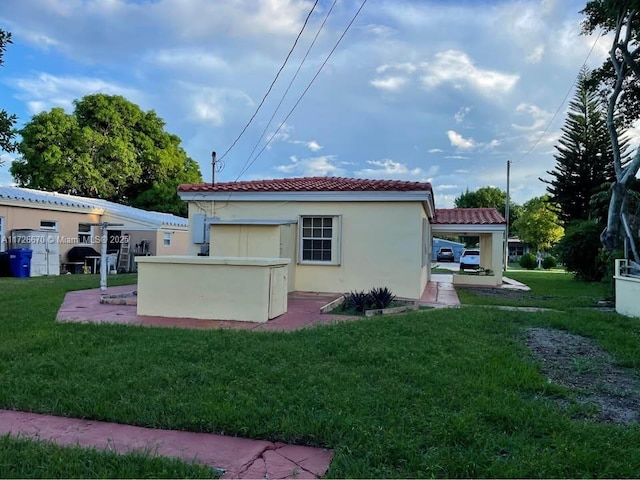 back of house with a yard