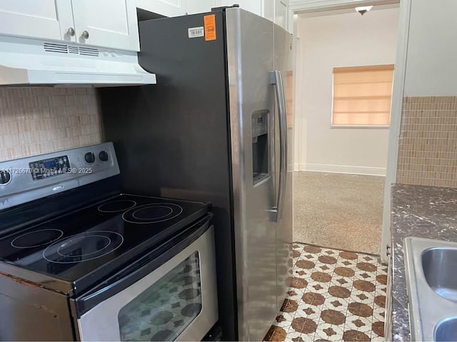 kitchen with sink, stone countertops, white cabinets, and stainless steel range with electric cooktop