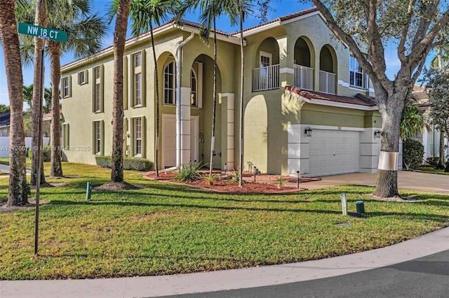 mediterranean / spanish-style home with a balcony, a garage, and a front lawn