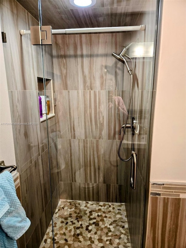 bathroom with a shower stall