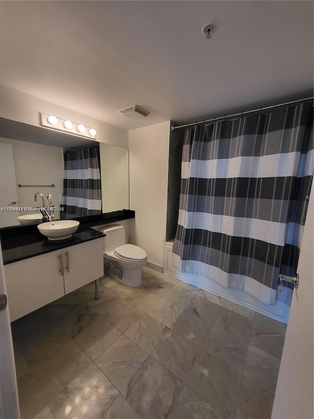 full bathroom with toilet, vanity, and shower / bathtub combination with curtain