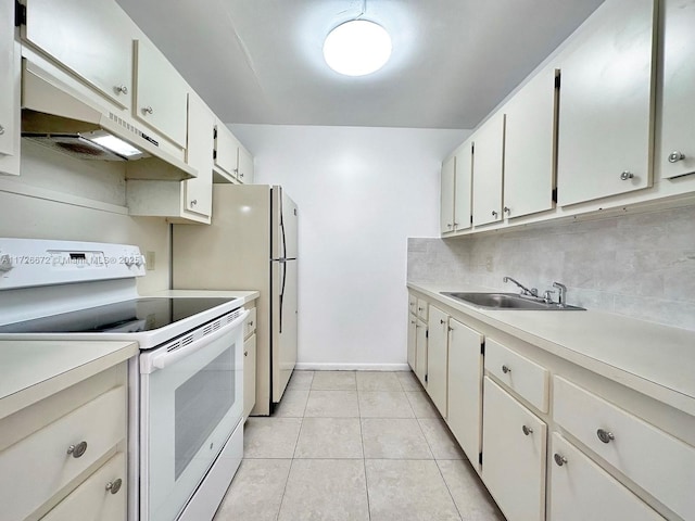 kitchen with sink, white electric range oven, light tile patterned floors, and white cabinetry