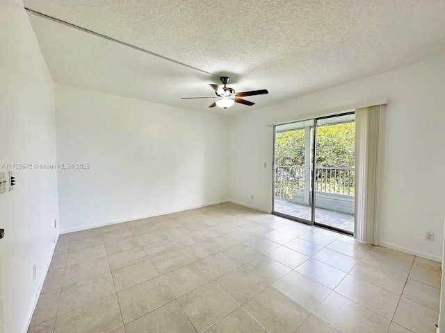 unfurnished room with a textured ceiling, ceiling fan, and light tile patterned floors