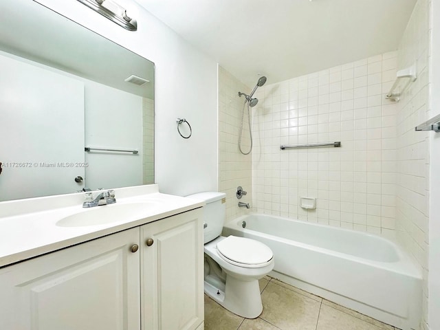 full bathroom with toilet, tile patterned flooring, vanity, and tiled shower / bath combo