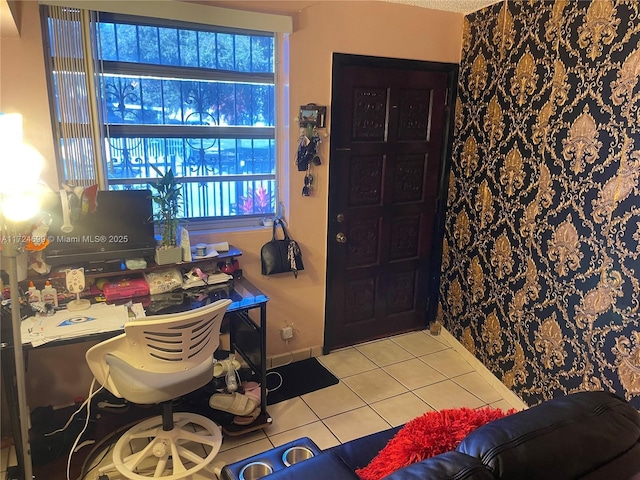 entryway with light tile patterned floors