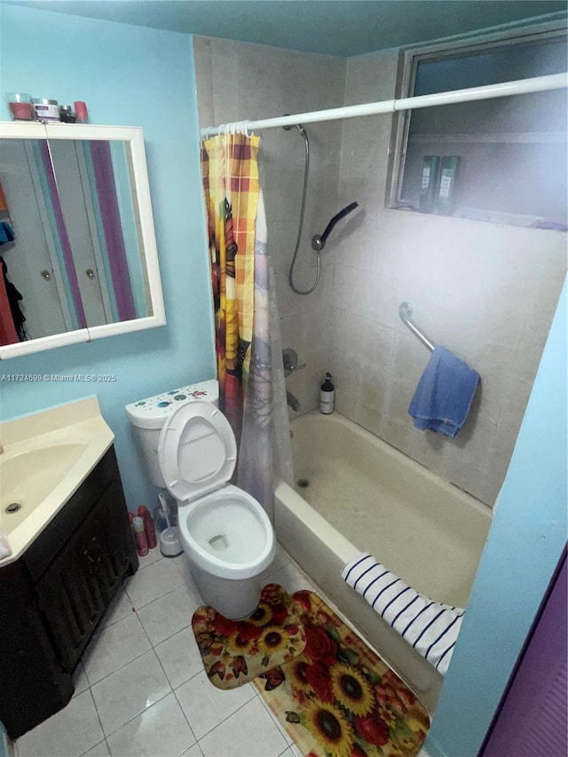 full bathroom featuring toilet, tile patterned floors, vanity, and shower / tub combo with curtain