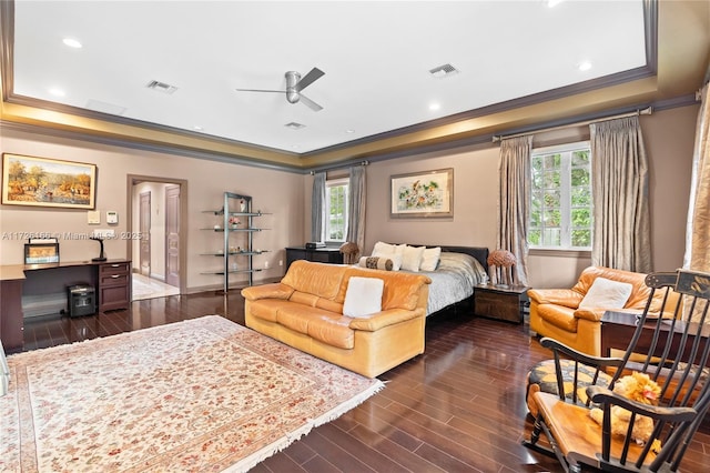 bedroom featuring ceiling fan, crown molding, and multiple windows