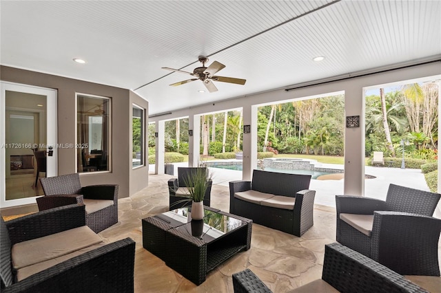 view of patio / terrace featuring ceiling fan, an outdoor hangout area, and a swimming pool with hot tub