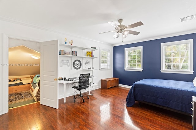 bedroom with ceiling fan, crown molding, and dark hardwood / wood-style floors