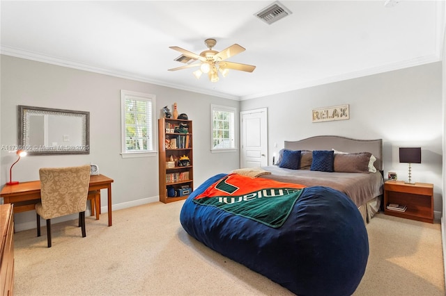 bedroom with ceiling fan, crown molding, and light colored carpet